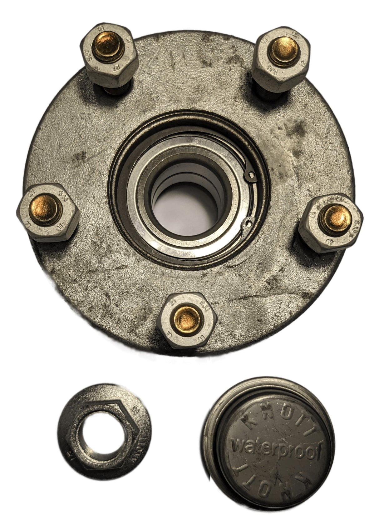Wheel hub assembly with bolts and a small round component on a white background
