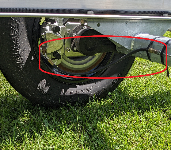 EZ Loader Torsion axle hydraulic hose shown mated to caliper on trailer for display location need