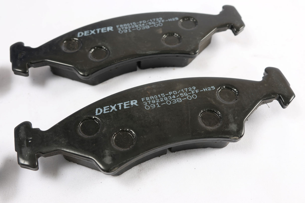 Two Dexter brand marine boat brake pads on a white background