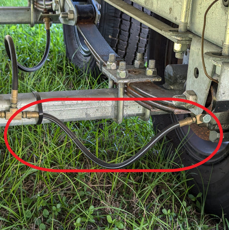 EZ Loader trailer hydraulic brake line routed along frame showing marine grade corrosion resistant setup