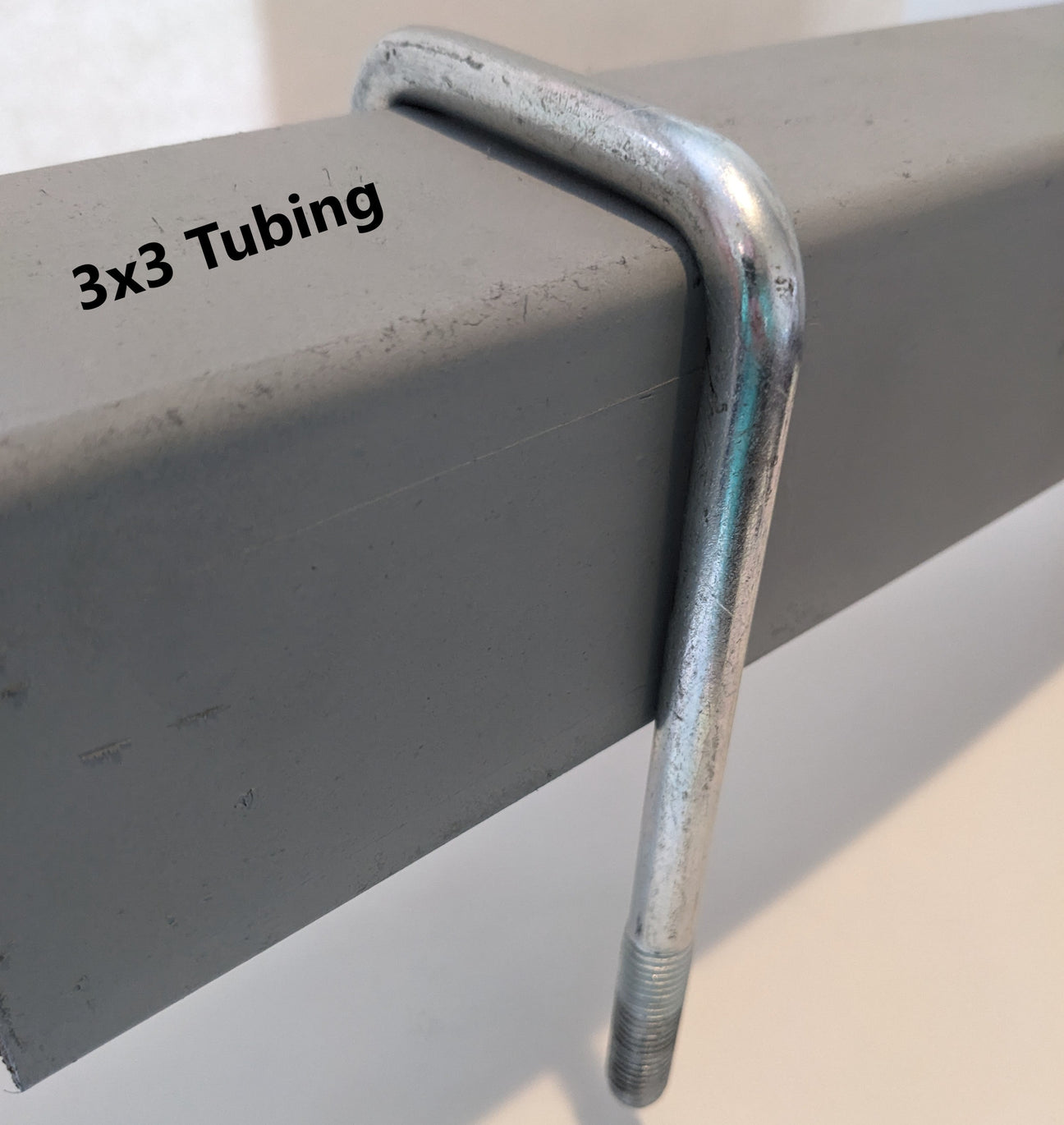 zinc trailer u-bolt securing axle to leaf spring on EZ Loader trailer suspension system