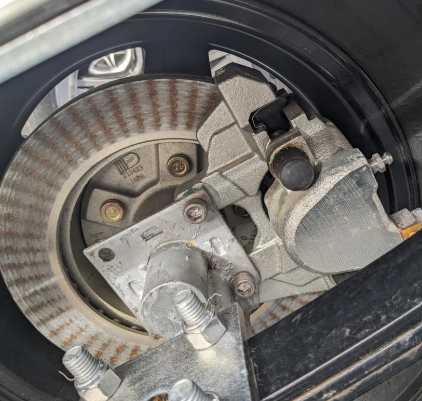 EZ Loader trailer brake rotor mounted on hub showing marine disc brake system for corrosion resistant performance