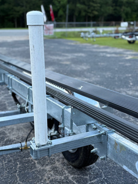 EZ Loader internal guide system for tritoon boat trailer showing installed accessory fitment