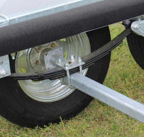 EZ Loader trailer suspension showing spring axle and mounting setup