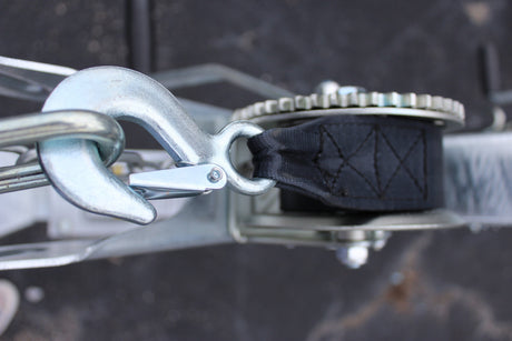 EZ Loader trailer winch mount bracket installed on frame showing adjustable position and winch support