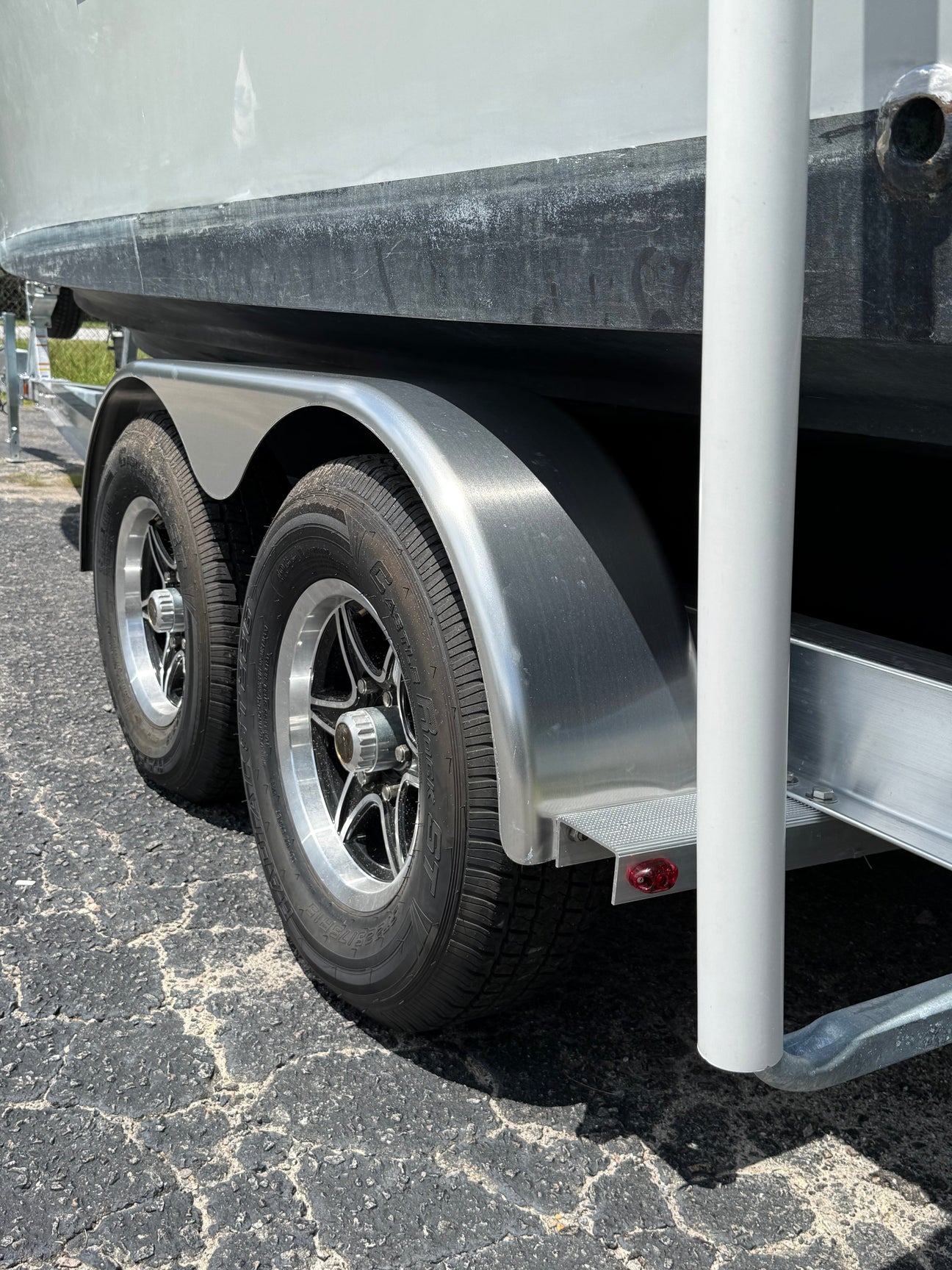 EZ Loader trailer strap guide installed at rear showing upright guide-on system for boat alignment