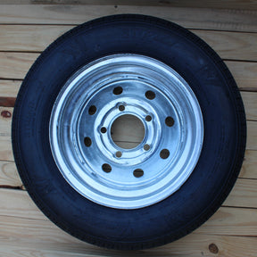 ST145/40R12 Load Range D tire and 5-lug galvanized trailer wheel assembly