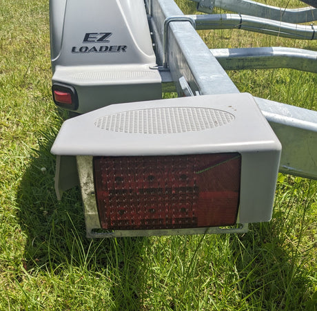 250-025173-10 Tail Light Cover Left  Side On Trailer