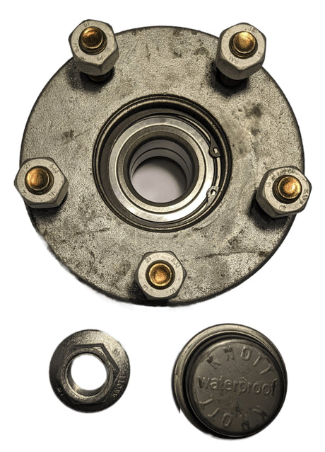 Wheel hub assembly with bolts and a small round component on a white background