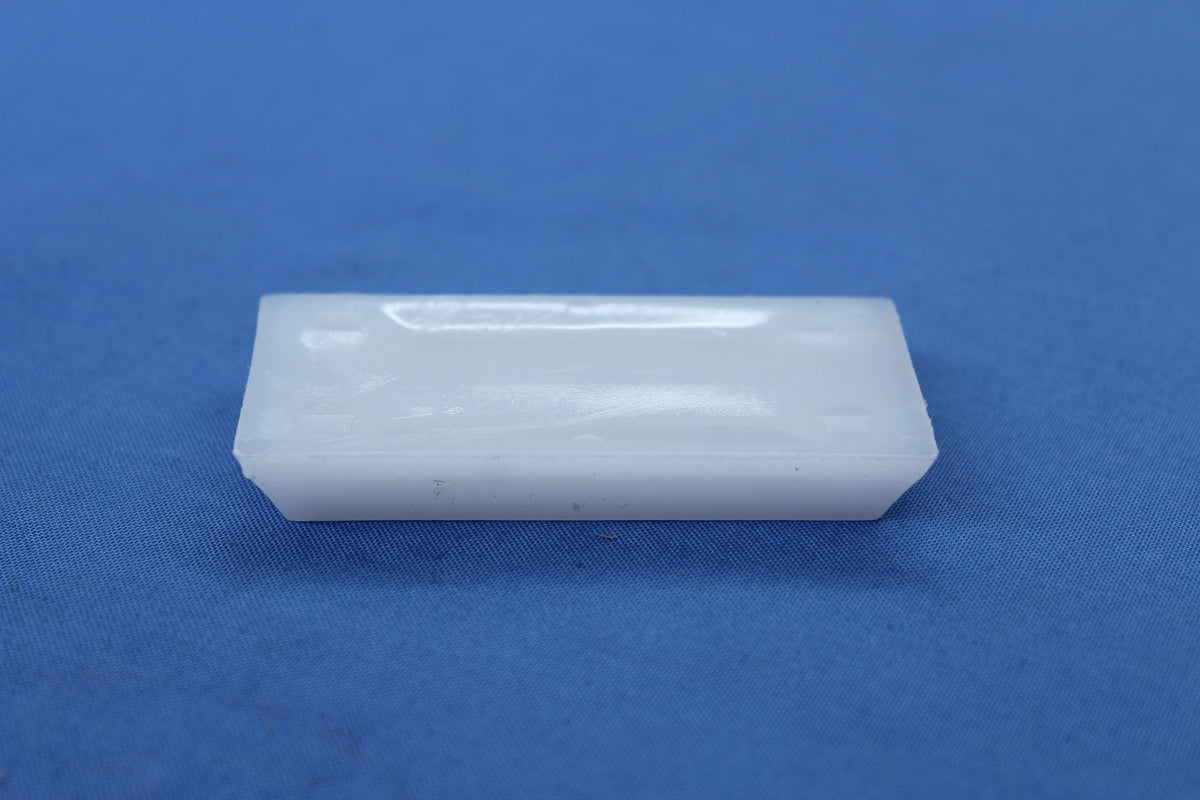 Top view of white Poly Glide pivot mount bushing 250-021769