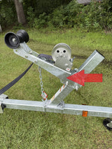 Trailer bow support area showing winch stand base, winch head, bow stop, and mounting hardware