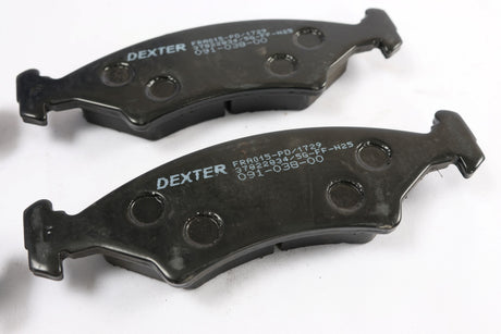 Two Dexter brand marine boat brake pads on a white background